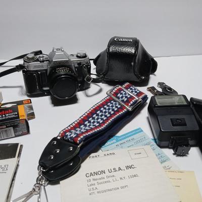 Classic Canon AE-1 with 50mm F1.8 Lens with many accessories and original manuals and more !