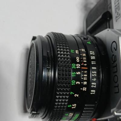 Classic Canon AE-1 with 50mm F1.8 Lens with many accessories and original manuals and more !
