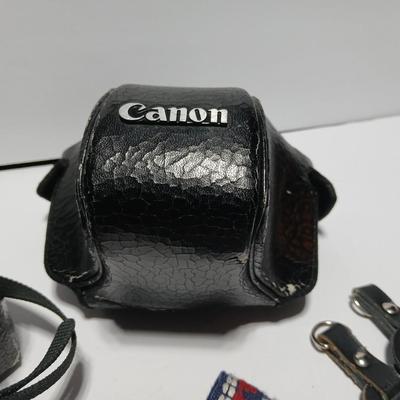 Classic Canon AE-1 with 50mm F1.8 Lens with many accessories and original manuals and more !