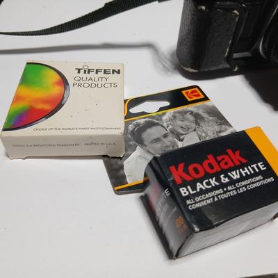Classic Canon AE-1 with 50mm F1.8 Lens with many accessories and original manuals and more !