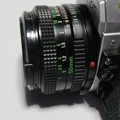 Classic Canon AE-1 with 50mm F1.8 Lens with many accessories and original manuals and more !