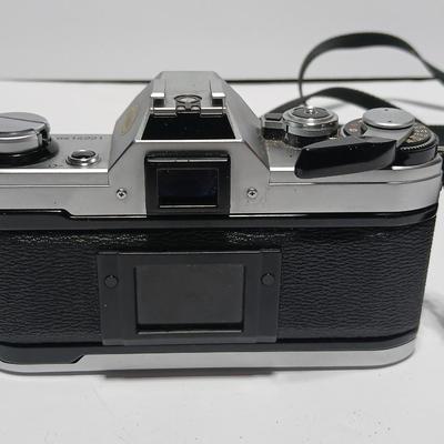 Classic Canon AE-1 with 50mm F1.8 Lens with many accessories and original manuals and more !