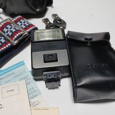 Classic Canon AE-1 with 50mm F1.8 Lens with many accessories and original manuals and more !