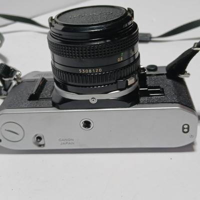 Classic Canon AE-1 with 50mm F1.8 Lens with many accessories and original manuals and more !