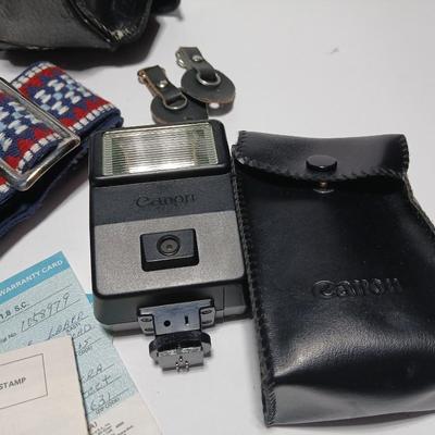 Classic Canon AE-1 with 50mm F1.8 Lens with many accessories and original manuals and more !