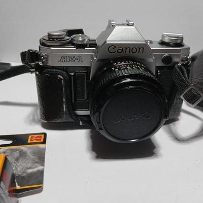 Classic Canon AE-1 with 50mm F1.8 Lens with many accessories and original manuals and more !