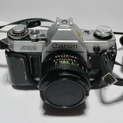 Classic Canon AE-1 with 50mm F1.8 Lens with many accessories and original manuals and more !