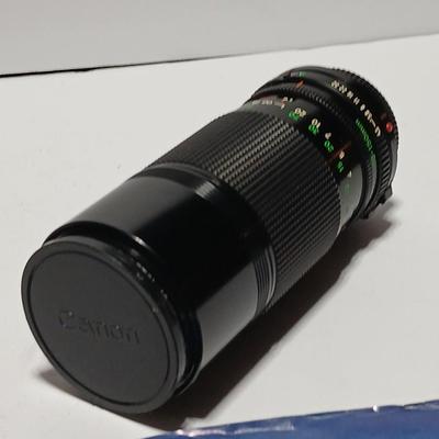 Canon FD Zoom lens 70-150mm with case and booklets and a vintage Cronus 3-S Digital Stopwatch also with case
