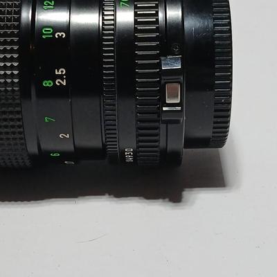 Canon FD Zoom lens 70-150mm with case and booklets and a vintage Cronus 3-S Digital Stopwatch also with case