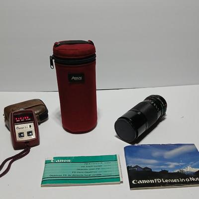 Canon FD Zoom lens 70-150mm with case and booklets and a vintage Cronus 3-S Digital Stopwatch also with case