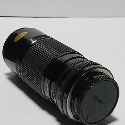 Canon FD Zoom lens 70-150mm with case and booklets and a vintage Cronus 3-S Digital Stopwatch also with case