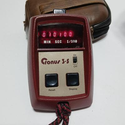Canon FD Zoom lens 70-150mm with case and booklets and a vintage Cronus 3-S Digital Stopwatch also with case