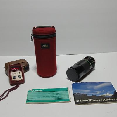 Canon FD Zoom lens 70-150mm with case and booklets and a vintage Cronus 3-S Digital Stopwatch also with case