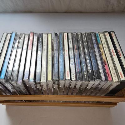 Assortment of music on CD in wood box with Sony Portable cd player