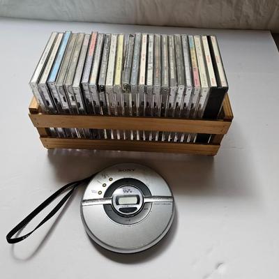 Assortment of music on CD in wood box with Sony Portable cd player
