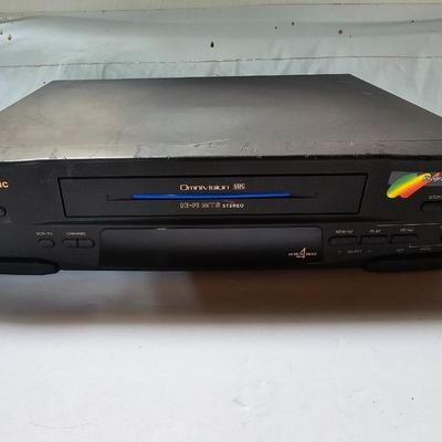 Panasonic Video Cassette Recorder VHS player VCR with an assortment of collectible Disney tapes
