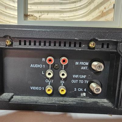 Panasonic Video Cassette Recorder VHS player VCR with an assortment of collectible Disney tapes