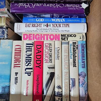 A large box of mostly hard-back books