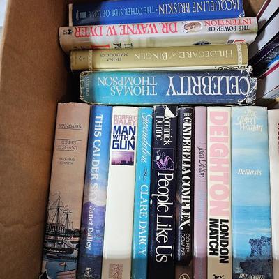 A large box of mostly hard-back books