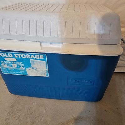 Rubbermaid 50 Quart cooler with two fishpoles, tackle box, and a water bottle