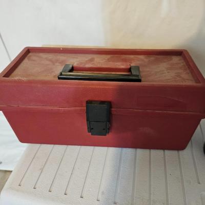 Rubbermaid 50 Quart cooler with two fishpoles, tackle box, and a water bottle