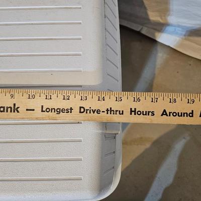 Rubbermaid 50 Quart cooler with two fishpoles, tackle box, and a water bottle