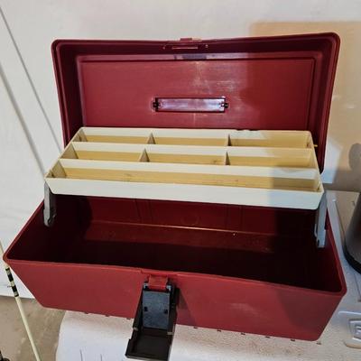 Rubbermaid 50 Quart cooler with two fishpoles, tackle box, and a water bottle