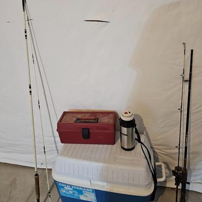 Rubbermaid 50 Quart cooler with two fishpoles, tackle box, and a water bottle