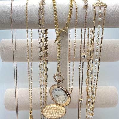 LOT 318: Vintage Uhrex Desk Clock with Collection of Gold Tone and Silver Tone Necklaces