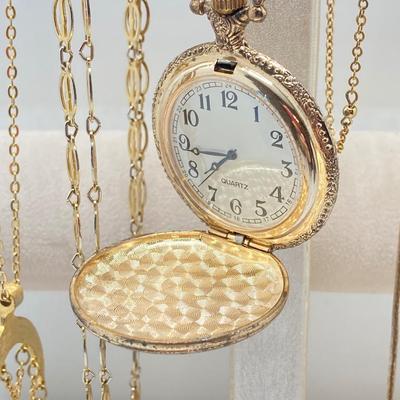 LOT 318: Vintage Uhrex Desk Clock with Collection of Gold Tone and Silver Tone Necklaces