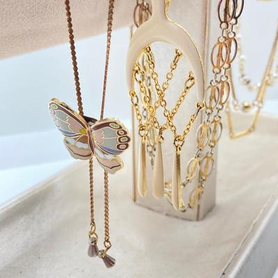 LOT 318: Vintage Uhrex Desk Clock with Collection of Gold Tone and Silver Tone Necklaces