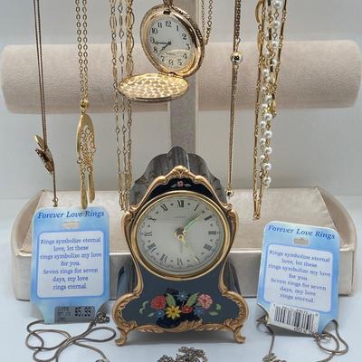 LOT 318: Vintage Uhrex Desk Clock with Collection of Gold Tone and Silver Tone Necklaces
