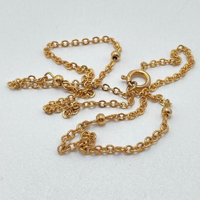 LOT 318: Vintage Uhrex Desk Clock with Collection of Gold Tone and Silver Tone Necklaces