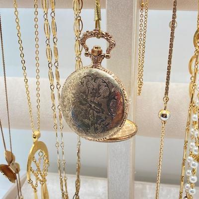 LOT 318: Vintage Uhrex Desk Clock with Collection of Gold Tone and Silver Tone Necklaces