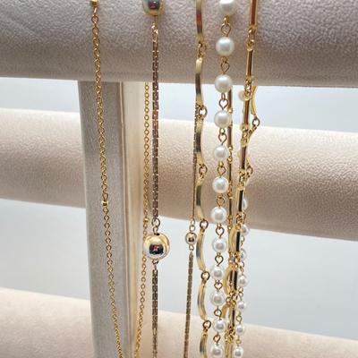 LOT 318: Vintage Uhrex Desk Clock with Collection of Gold Tone and Silver Tone Necklaces