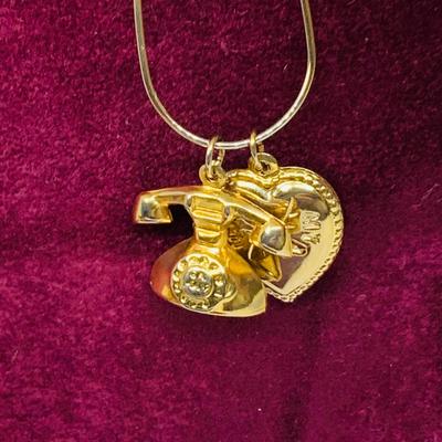 Lot 298: Gold-tone Charm Holder with 23” Chain and Unmarked and 12k GF Charms