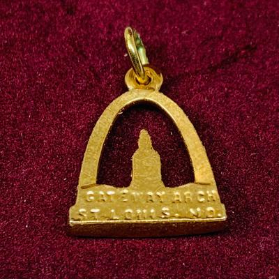Lot 298: Gold-tone Charm Holder with 23” Chain and Unmarked and 12k GF Charms