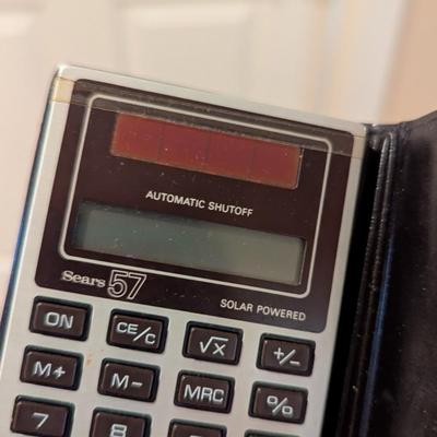 Assortment Of Handbags & Pocket Calculators