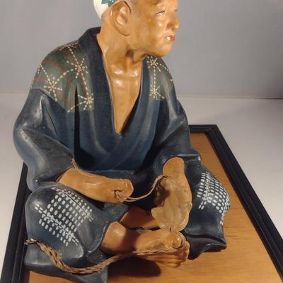 Vintage Japanese Clay Figurine with Mat- Shoe Maker (#14). (K)