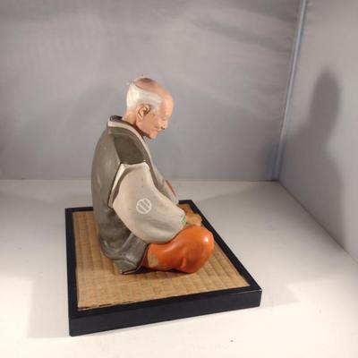 Vintage Hakata Urasaki Japanese Clay Figurine with Mat- Man Sitting (#13). (K)