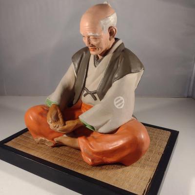 Vintage Hakata Urasaki Japanese Clay Figurine with Mat- Man Sitting (#13). (K)