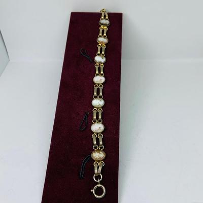 Lot 302: Collection of Vintage Cameos - 3” Pendant on a 24” Chain, 7. 1/2” Bracelet and a 2” Mother of Pearl Clip