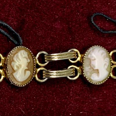 Lot 302: Collection of Vintage Cameos - 3” Pendant on a 24” Chain, 7. 1/2” Bracelet and a 2” Mother of Pearl Clip