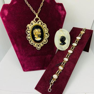 Lot 302: Collection of Vintage Cameos - 3” Pendant on a 24” Chain, 7. 1/2” Bracelet and a 2” Mother of Pearl Clip