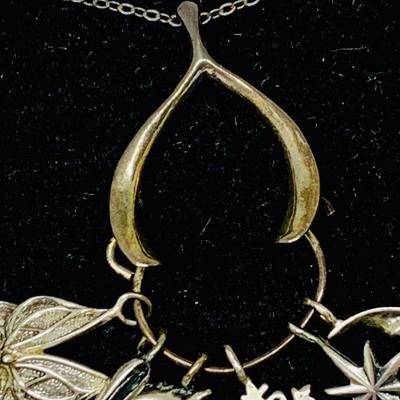 Lot 303: Franklin Mint - The Seven Days of Wishes Sterling Silver Charms and Wishbone Charm Holder and Chain and COA