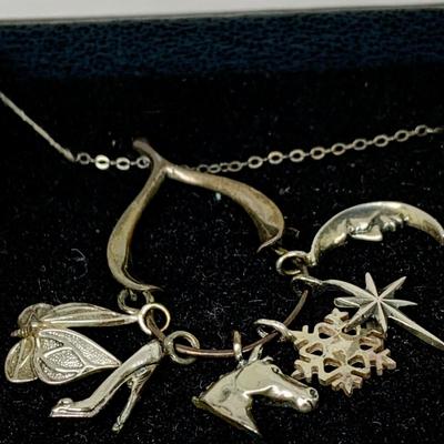 Lot 303: Franklin Mint - The Seven Days of Wishes Sterling Silver Charms and Wishbone Charm Holder and Chain and COA
