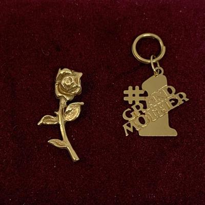 Lot 308: Set of Two 14 Gold Charms”#1 Grandmom” and a Rose 1.20g Tw