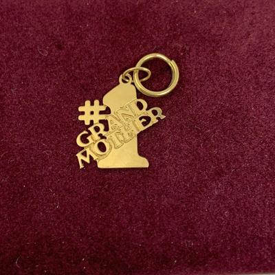 Lot 308: Set of Two 14 Gold Charms”#1 Grandmom” and a Rose 1.20g Tw