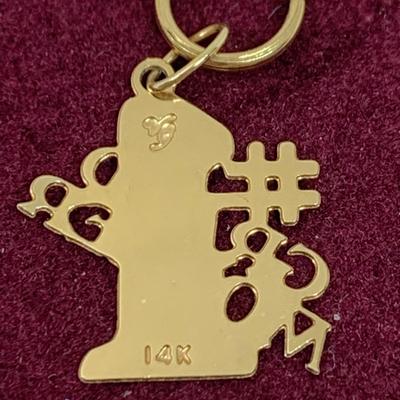 Lot 308: Set of Two 14 Gold Charms”#1 Grandmom” and a Rose 1.20g Tw