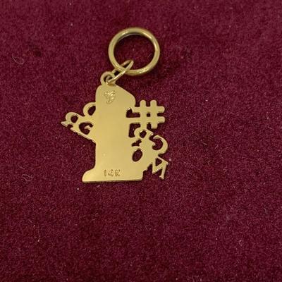 Lot 308: Set of Two 14 Gold Charms”#1 Grandmom” and a Rose 1.20g Tw